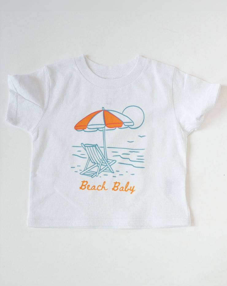 White t-shirt with beach-themed design and 'Beach Baby' text on a white background