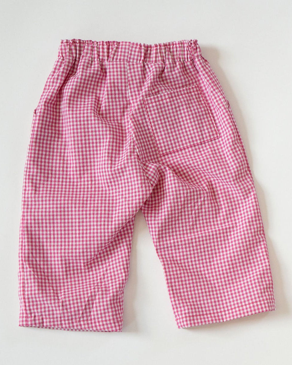 Pink checkered pants on a white background