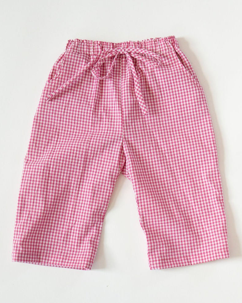 Pink checkered pants on a white background