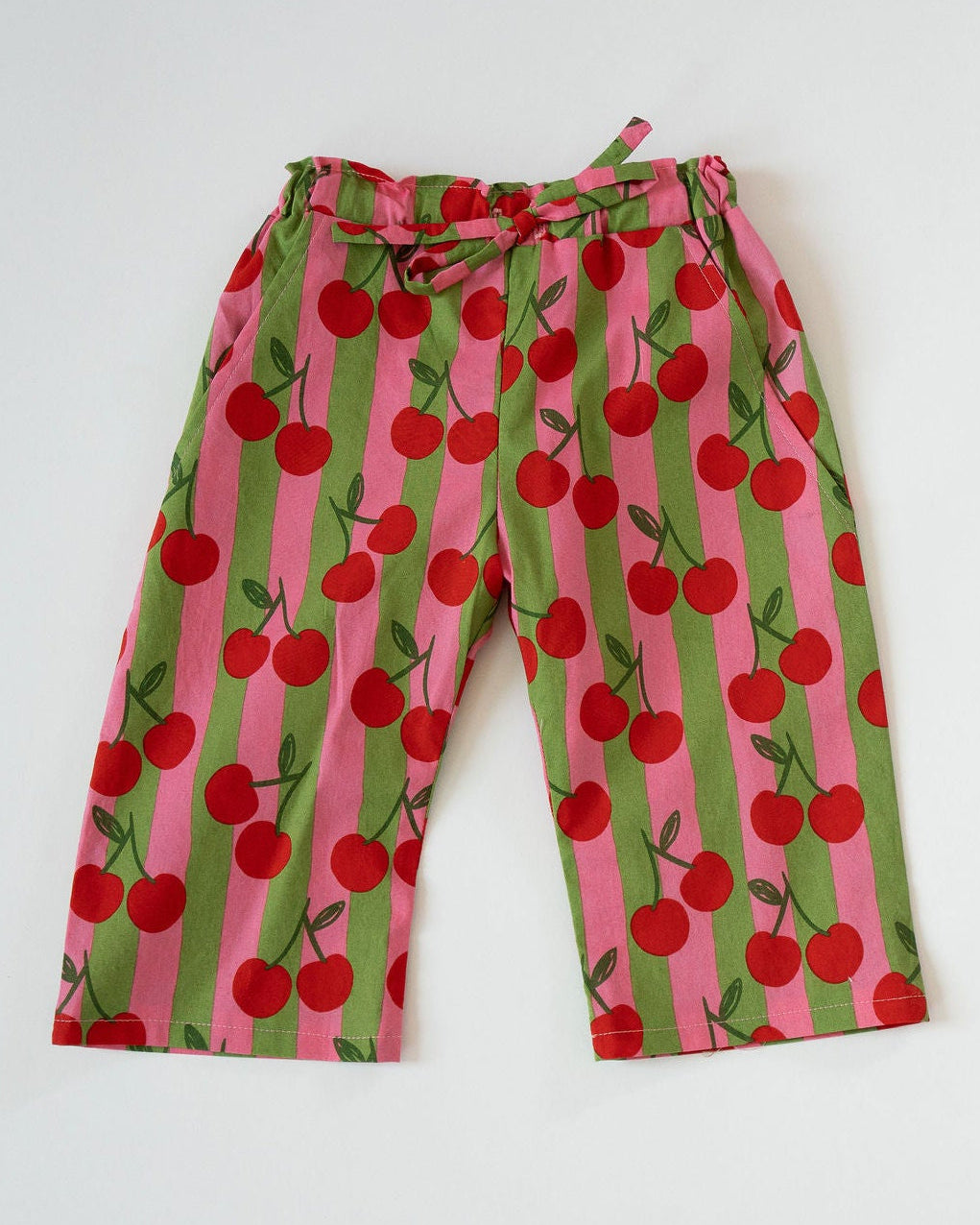Pajama pants with cherry pattern on a white background