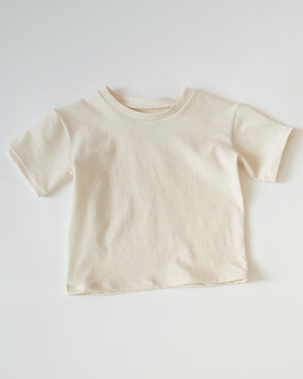 Beige t-shirt on a white background