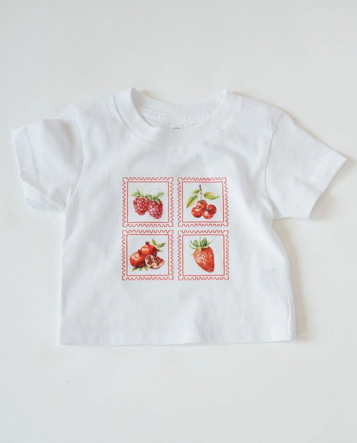 White t-shirt with strawberry design on a white background