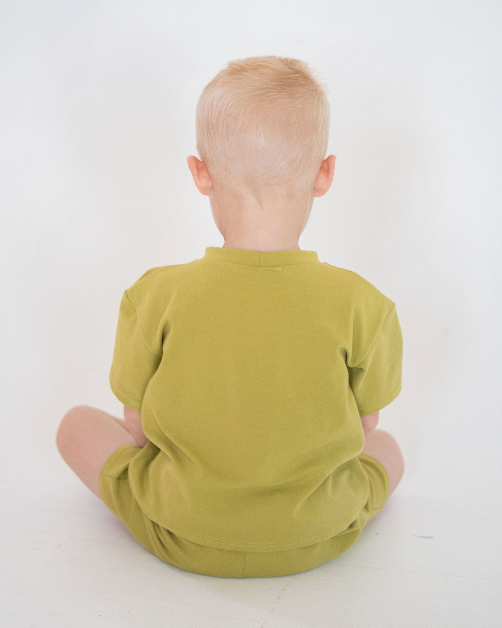 Green t-shirt on a white background