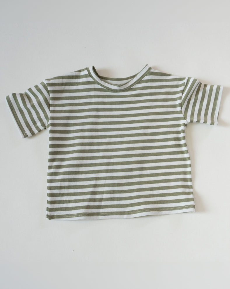 Green and white striped t-shirt on a light gray background