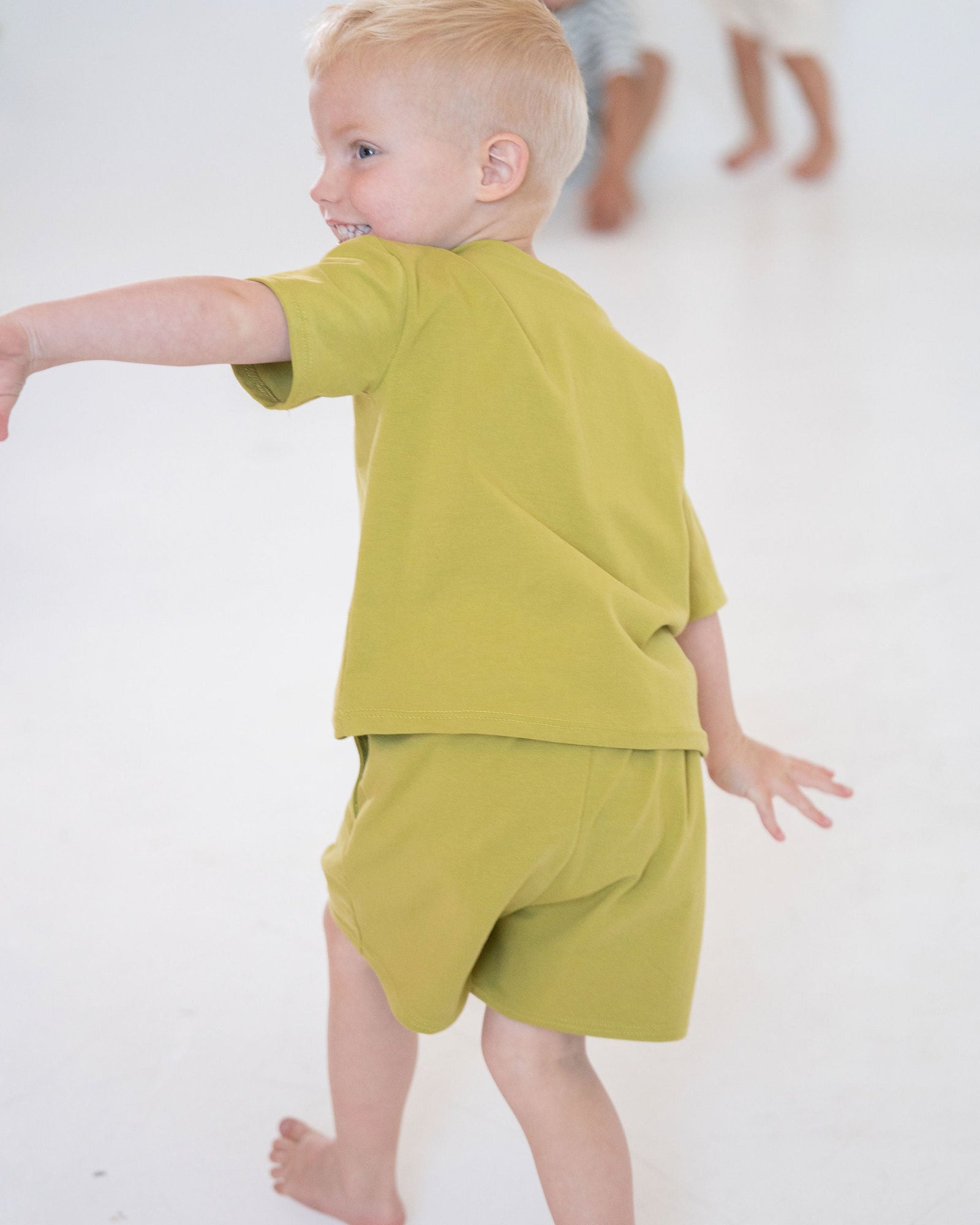 Green shorts with a drawstring on a white background
