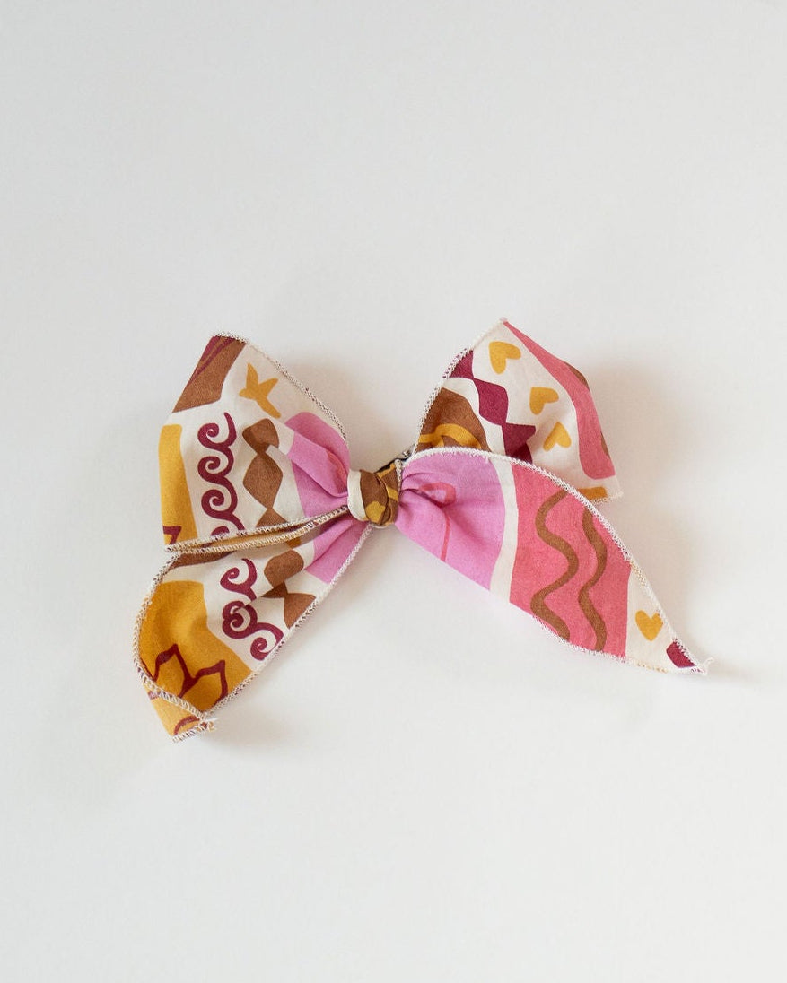 Colorful hair bow on a white background