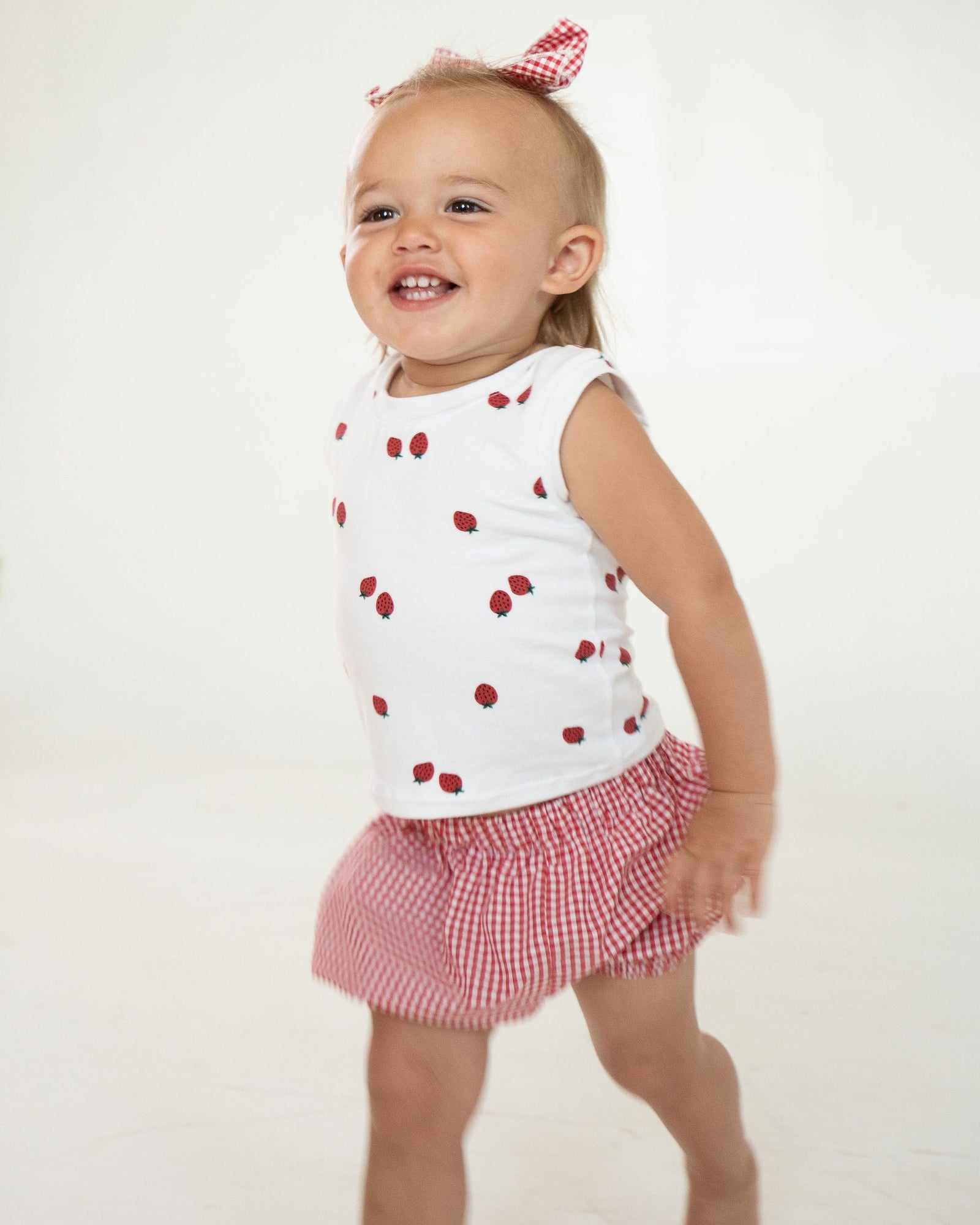 Red checkered baby bloomers on a white background