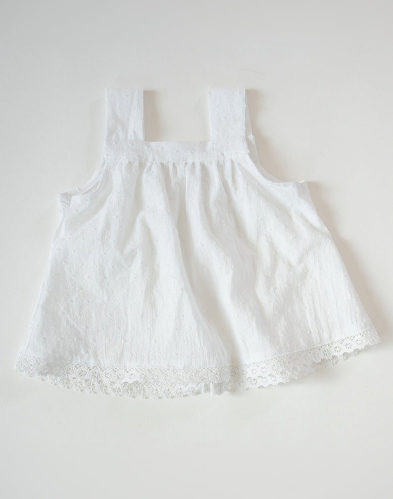 White lace dress on a white background