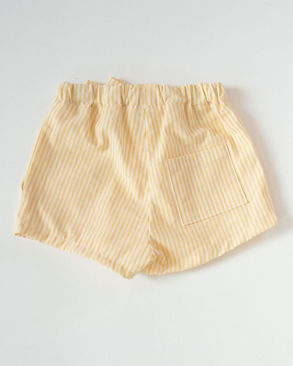 Yellow striped shorts on a white background