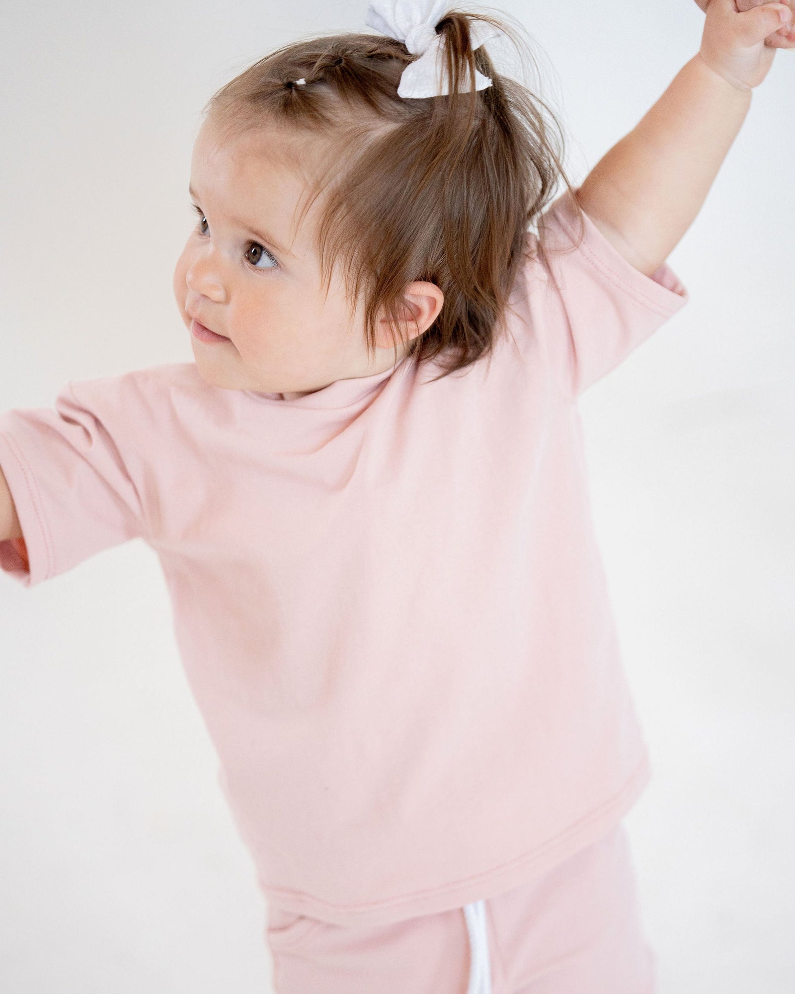 Pink t-shirt on a light gray background